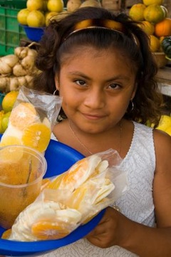 girl selling fruit